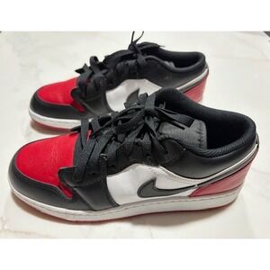 Air Jordan 1 Low in a black, red, and white colorway, Bred Toe Chicago Size 6Y